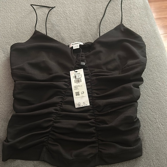 Garage tank top that is mesh and see through, shown in last pic. - Picture 1 of 4